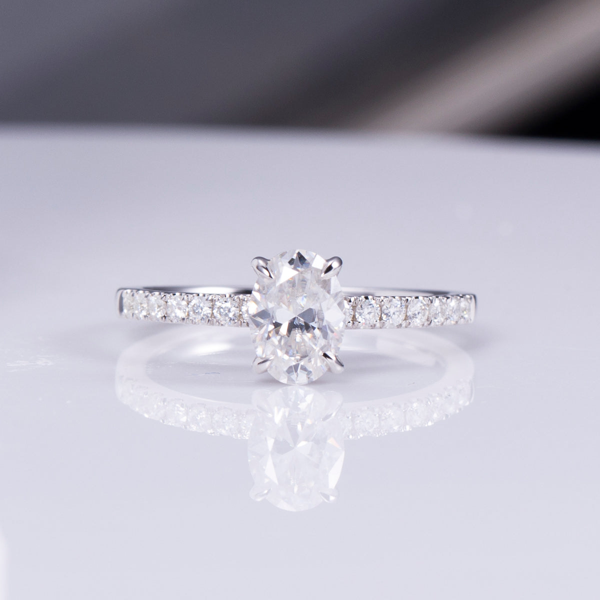 Oval Cut Diamond Engagement Ring with Pavé Band